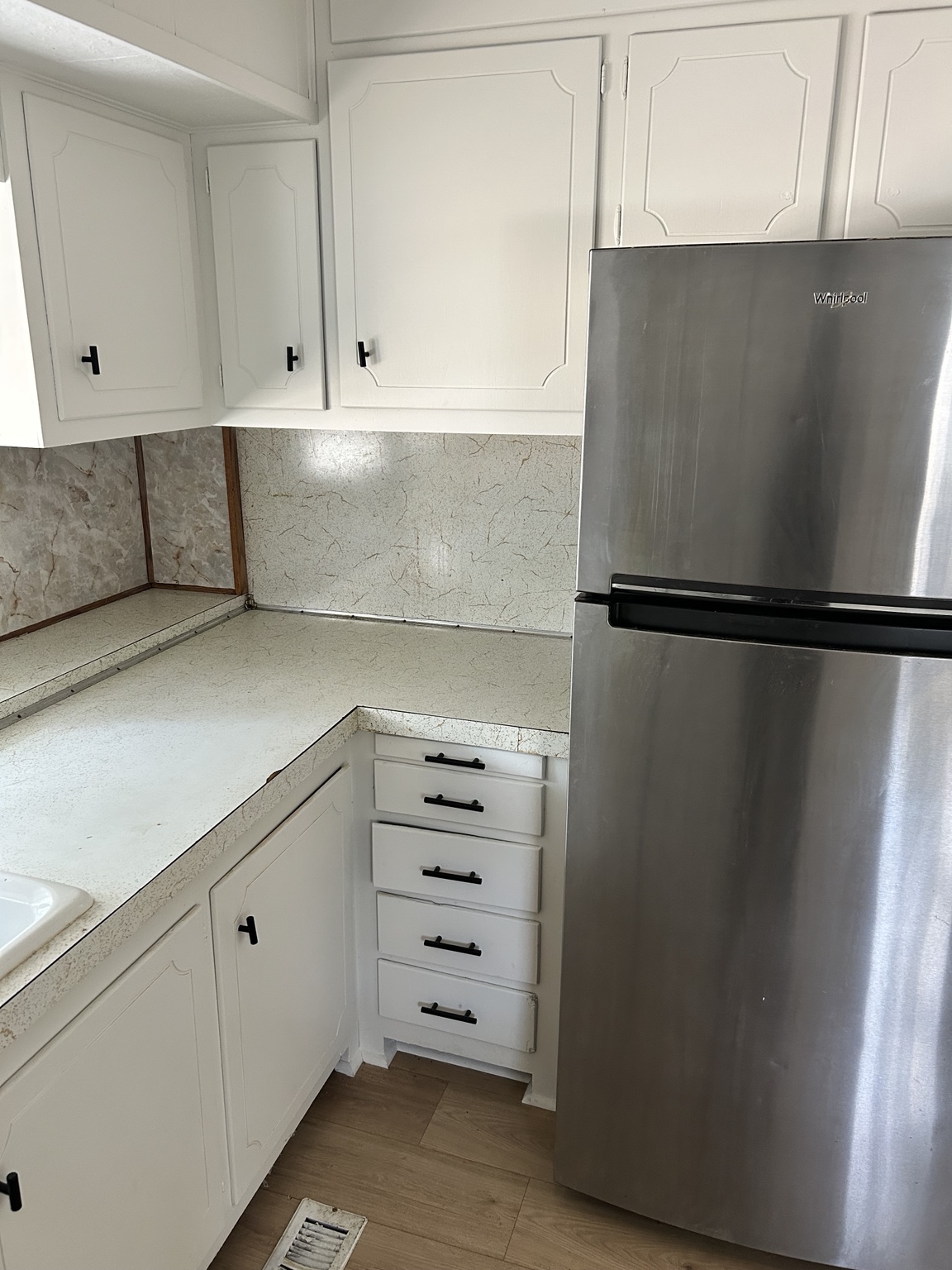 Kitchen cabinetry and refrigerator thumbnail